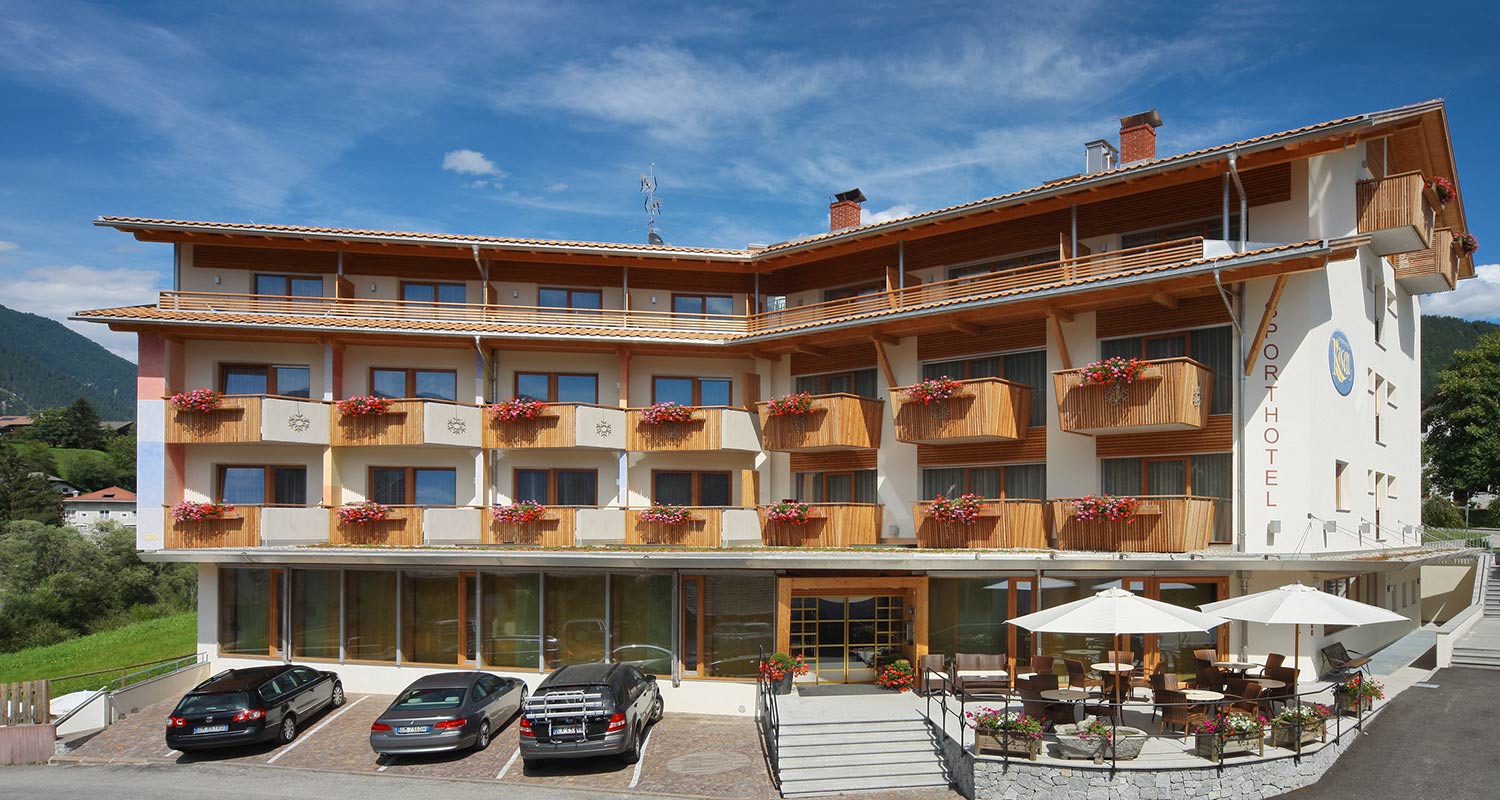 Exterior view of Sporthotel Rasen in Antholz on a beautiful summer day