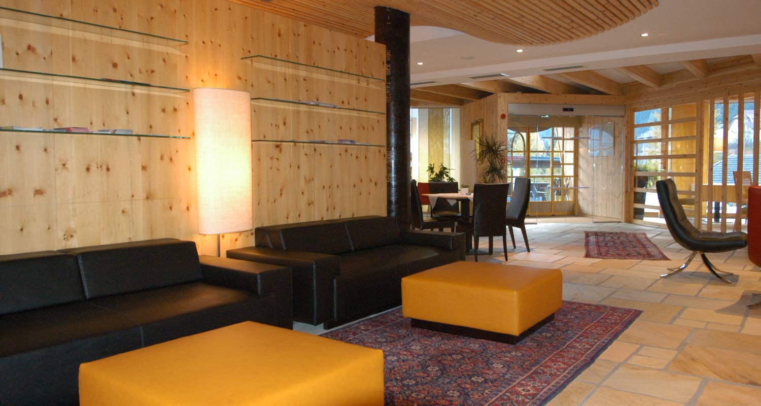 Modern, wood panelled entrance hall at Sporthotel Rasen
